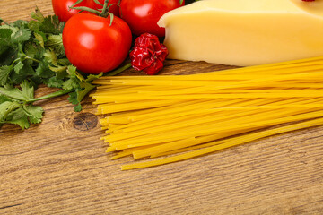 Raw Italian spaghetti heap with cheese