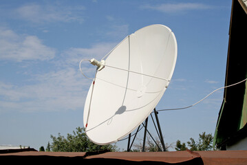 Large white satellite dish. Telecommunications. Satellite Internet and TV.