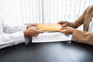 Businesspeople transfer of bribe money to his partner, corruption concepts.
