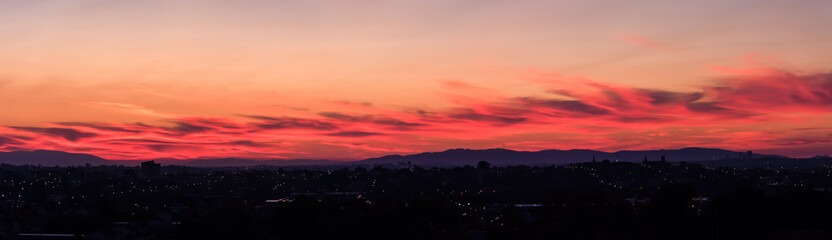 A panoramic sky landscape over the suburbs of Melbourne, Australia with Mt Dandenong on the horizon