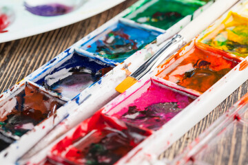 mixed together multi-colored paints