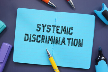 Financial concept about Systemic Discrimination with phrase on the piece of paper.