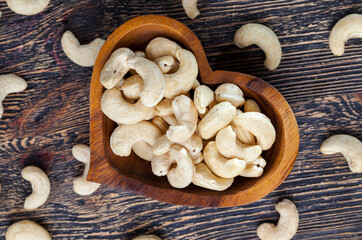 crunchy cashew nuts in a heart shaped bowl