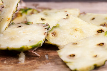 peeled ripe sweet sour pineapple, pineapple skin cut off