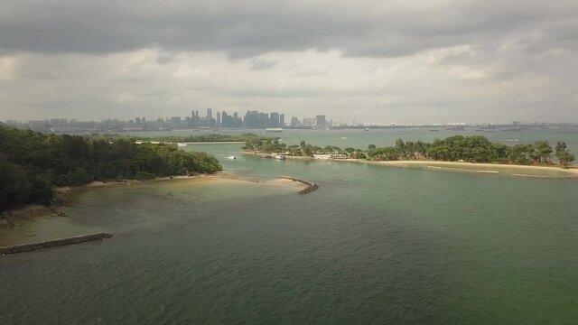 Drone shot of Kusu island with city backdrop , cloudy, Singapore