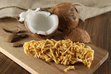 Cocada, coconut candy. Composition on wooden background