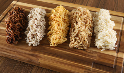 Cocada, coconut candy. Composition on wooden background