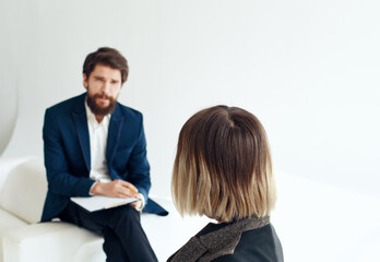 Women and men in suits In the bright room of interviews hiring