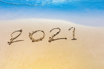 Happy New Year 2021 is coming concept sandy tropical ocean beach lettering