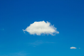 Naklejka na ściany i meble Blue sky background with clouds 