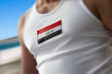 The national flag of Iraq on the athlete's chest