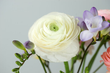 Beautiful bouquet with spring ranunculus and freesias