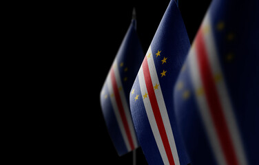 Small national flags of the Cape Verde on a black background