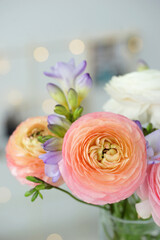 Beautiful bouquet with spring ranunculus and freesias