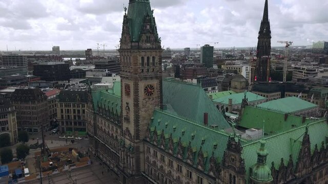 flying around the town hall of hamburg germany, circeling