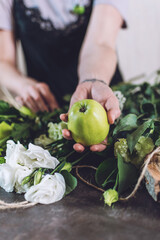 Floral Design Courses Online, Florist business, small business, Flower Arranging, florist trends. Florist woman shows master class, tutorial on creating organic flower fruit edible bouquet