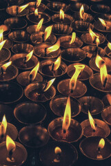 Burning candles at a Buddhist temple