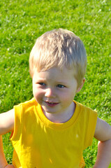 Young boy or kid plays soccer or football sports for exercise and activity.