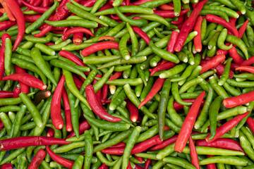 Top View A pile of Red and Green Chilli Padi, Bird's Eye Chilli, Bird Chilli, Thai pepper pattern texture.