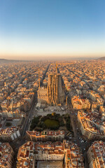 Aerial drone shot of Barcelona city center in Sunrise golden hour during Spain winter