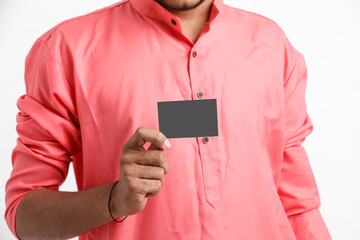 Young indian farmer showing card on white background