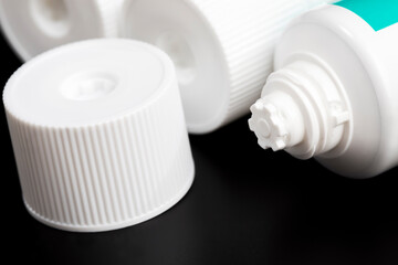 closed white plastic tube with paste or other cosmetics