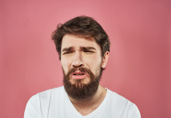 Fototapeta premium Portrait of a man with a thick beard white t-shirt brunette model close-up