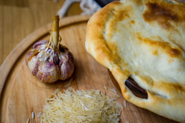 The concept of oriental cuisine. Homemade georgian Uzbek pilaf or plov from lamb served in cast...
