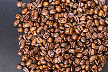 whole and flavorful coffee beans scattered in a chaotic order
