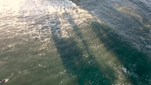 Aerial view of Surfers at Santa Cruz Beach California shot in 4k high resolution
