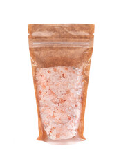 Coarse Himalayan salt in a brown paper bag. Doy-pack with a plastic window for bulk products. Close-up. White background. Isolated.