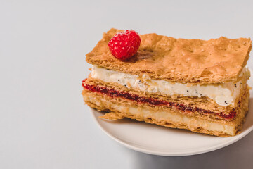 Cake with raspberries and cream layer