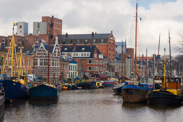 Noorderhaven (northern Harbour) in Groningen with old warehouses converted to houses along the water.