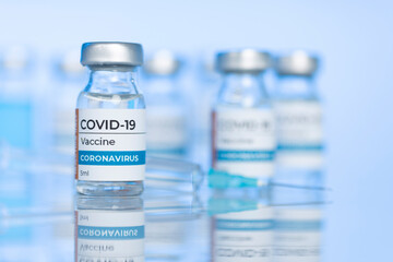 Coronavirus Covid-19 Vaccine vial glass bottles and syringe.