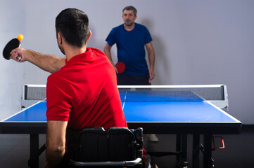 Wheelchair user playing table tennis