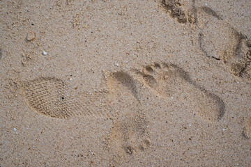 Fototapeta na wymiar Footprints in the sand on The beach at Phi Phi island Andaman sea. Krabi Province , Thailand.