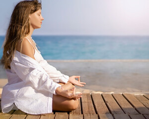 Fototapeta na wymiar Teenager girl woman meditation on the beach Within