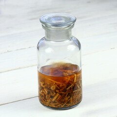 Tincture from dried nettle roots and alcohol.   Urtica diocica, curative herb tincture is good for hair growing and regeneration. Help against hair loss.