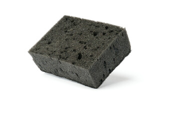black kitchen sponge isolated on white . the concept of cleanliness and order