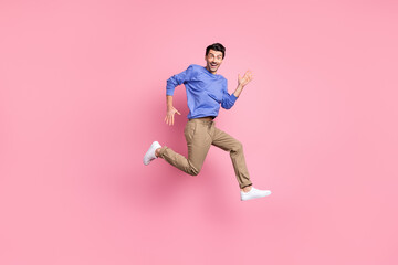 Fototapeta na wymiar Full body profile side photo of charming funny man run empty space excited sale isolated on pink color background
