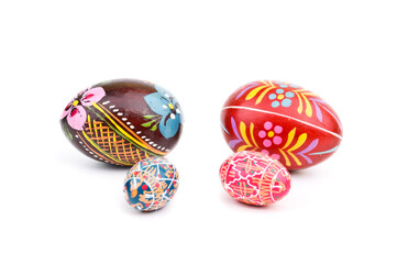 Easter egg decor on isolated on white background. Nest with handmade painted eggs pattern.