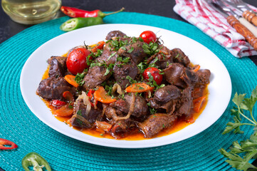 Roast turkey liver with vegetables and herbs. Diet dish