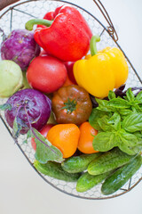 Metal basket with fresh vegetables