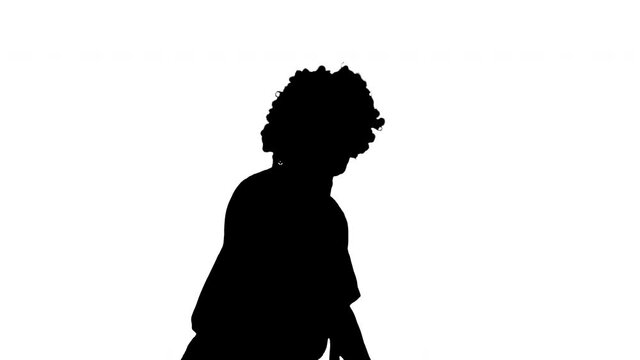 Silhouette Funny clown rushing somewhere walking fast, almost running.