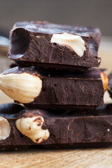 divided into parts chocolate bar with whole nuts