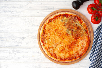 Pizza with four cheeses served on wooden background