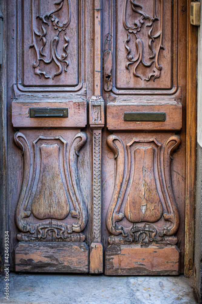 Wall mural Ornate wooden door in Buenos Aires