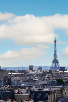 Looking across paris rooftops toward the eiffel tower.