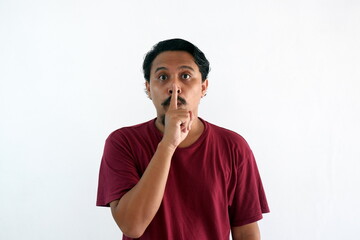 silent gesture asian man while looking camera