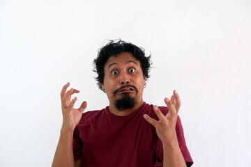 rage asian man mad and looking at camera, isolated in white